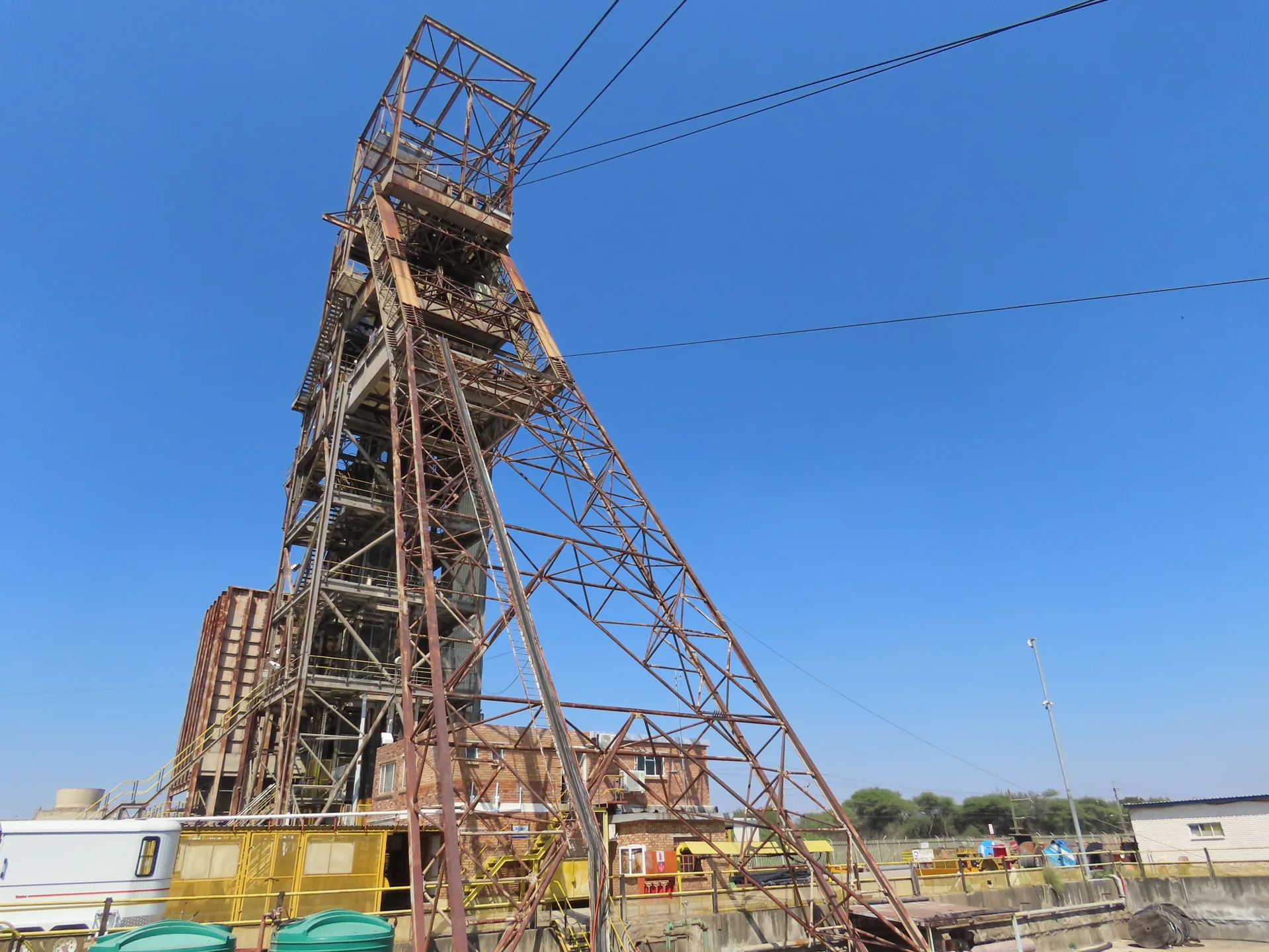 Mine shaft headgear against a clear blue sky
